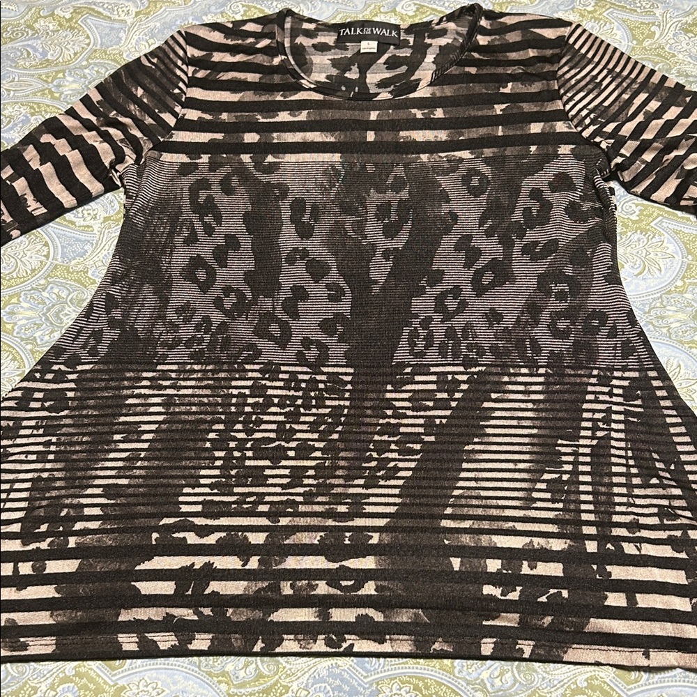 Talk of the Walk Large Animal Print slightly sheer top.